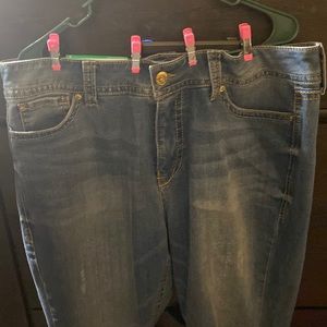 Cropped jeans with roll up at bottom rip on the knee. New never worn